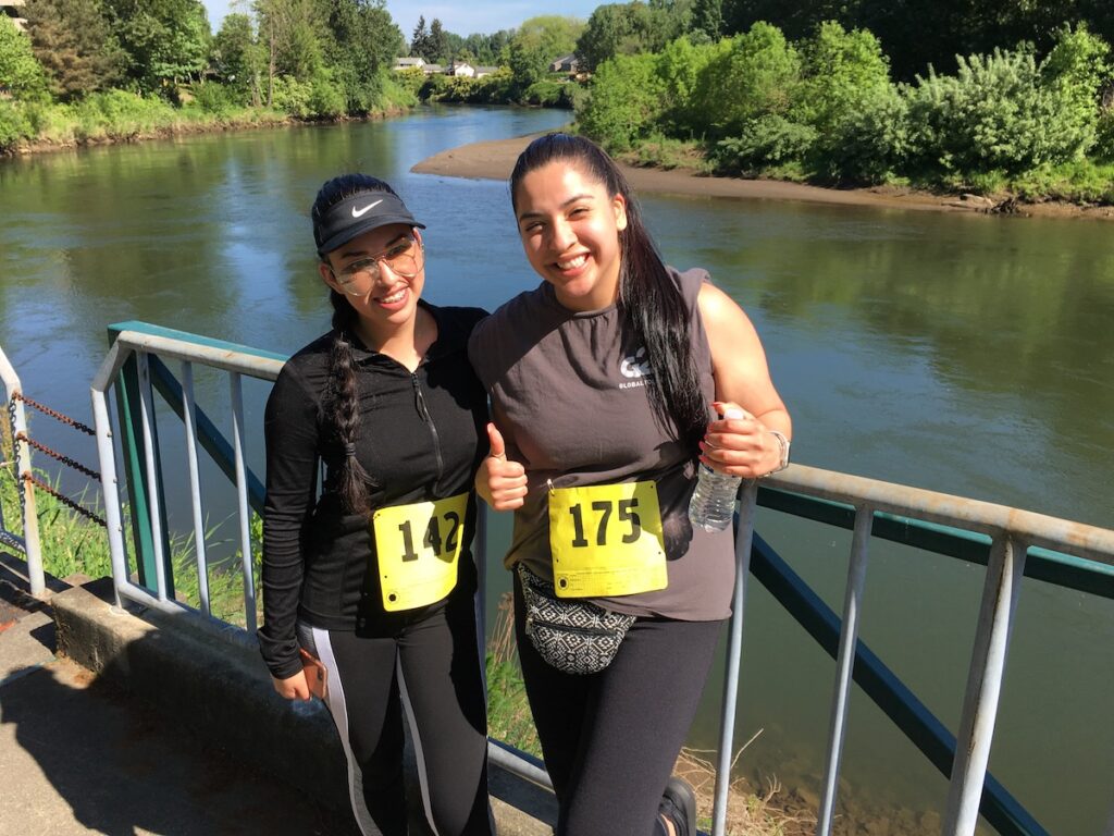 race participants next to river