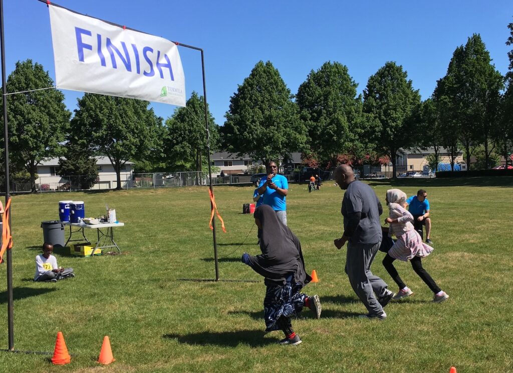 participants run to finish line